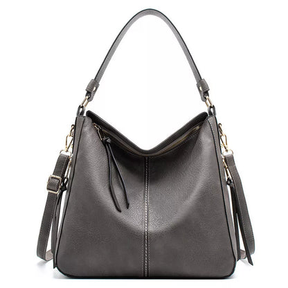 Women's hobo bag in PU material with multiple compartments and a zipper opening