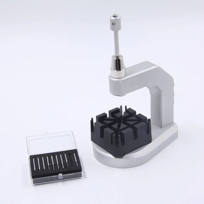 Silver multi-purpose press strap removal tool made from tool steel.