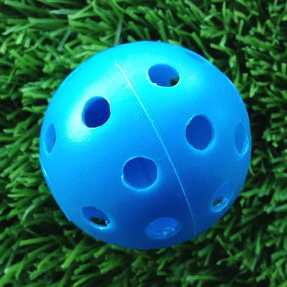 Hollow plastic golf practice balls in various colors for indoor use