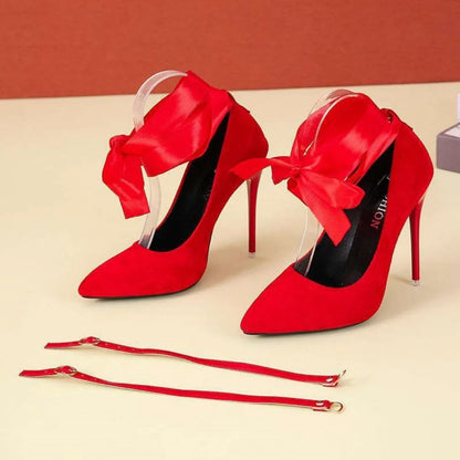Black pointed toe stiletto sandals with a lace strap and high heel
