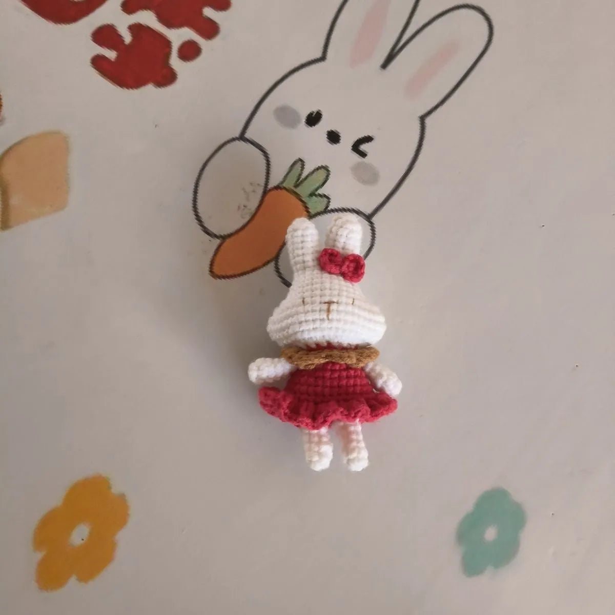 Hand-crocheted wool yarn rabbit keychain pendant with decorative design