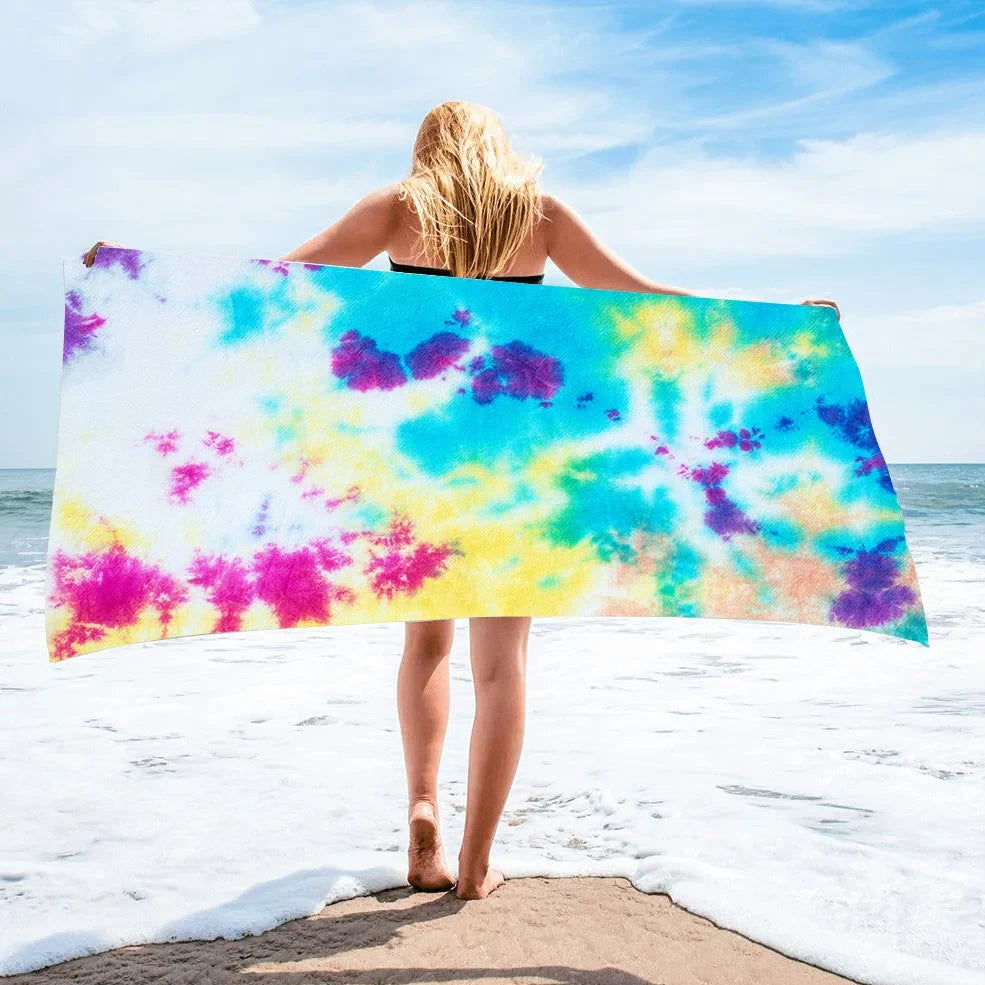 Square beach towel with tie-dye pattern showing superfine fibre texture and vibrant colours