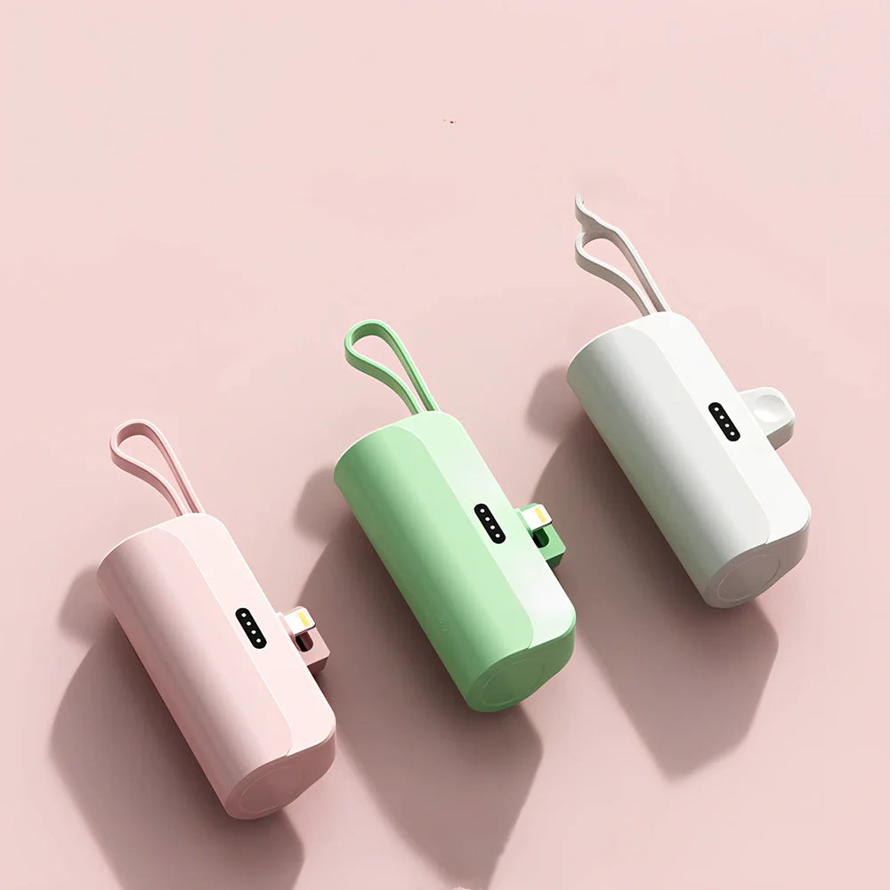 White capsule power bank showing compact 79mm size with USB charging ports visible