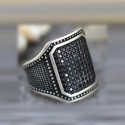 Black alloy ring with copper inlays and zircon accents, shown in a unisex style on a hand, sizes 7-13 available