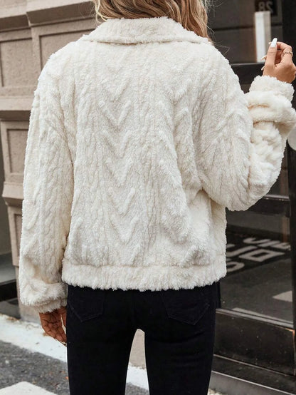 Ivory white women's double-sided plush button-front cardigan coat on a hanger.