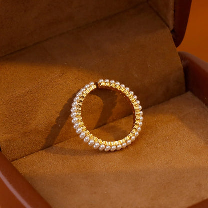Gold electroplated pearl ring with open mouth geometric design and round pearl elements