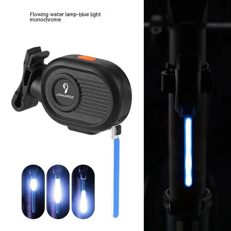Bicycle rear safety light with a cascading waterfall LED light effect, mounted on a seat post.