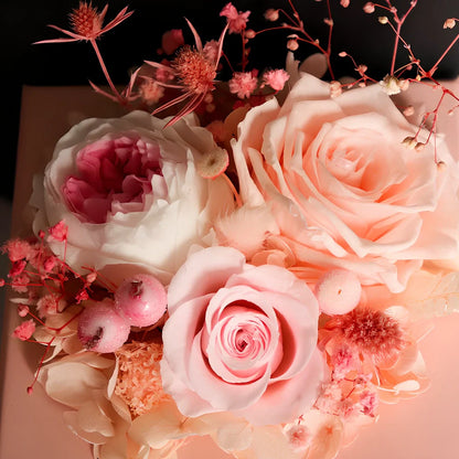 Preserved eternal flower gift box with roses, carnations, and hydrangea in red and pink colours