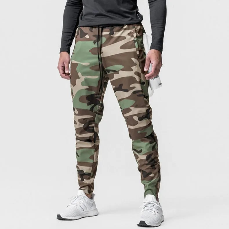 Men's grey fitness trousers with ankle ties, made from quick-drying polyester, for exercise and casual use.