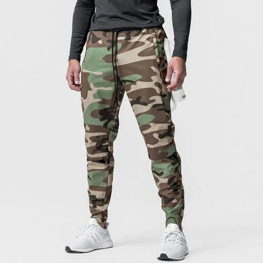 Men's grey fitness trousers with ankle ties, made from quick-drying polyester, for exercise and casual use.