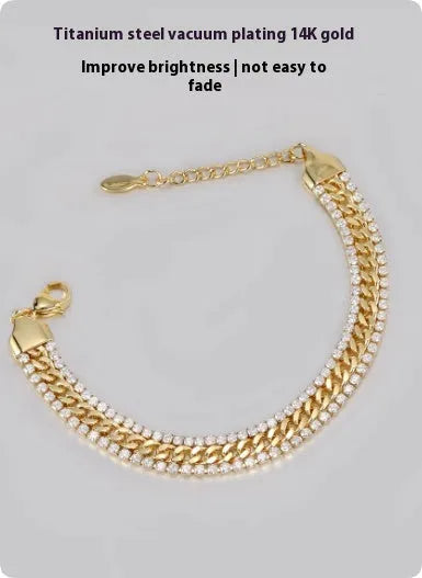 A gold-coloured unisex tennis bracelet with inlaid stones on a titanium steel band.