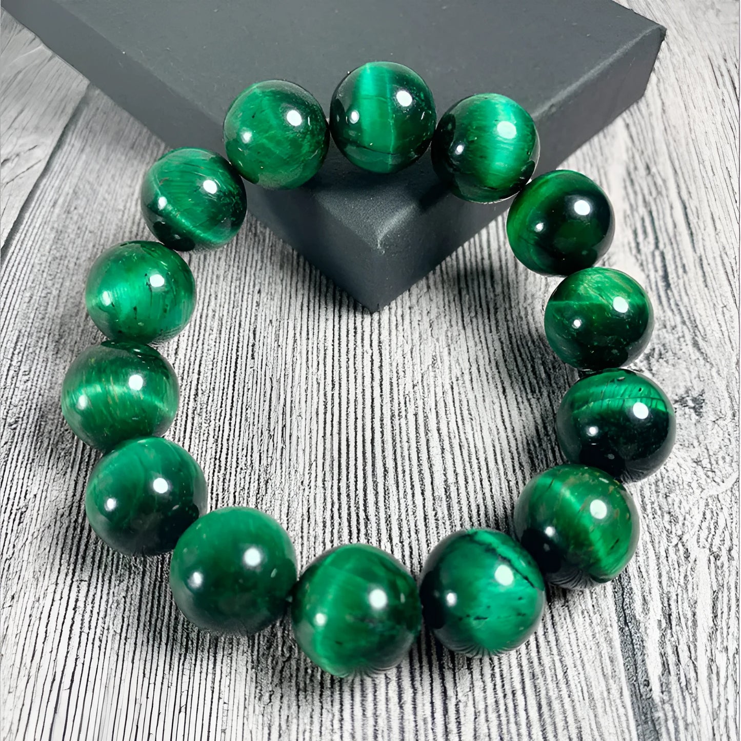 Green Tiger Eye stone bracelet with geometric beads, showing size options.