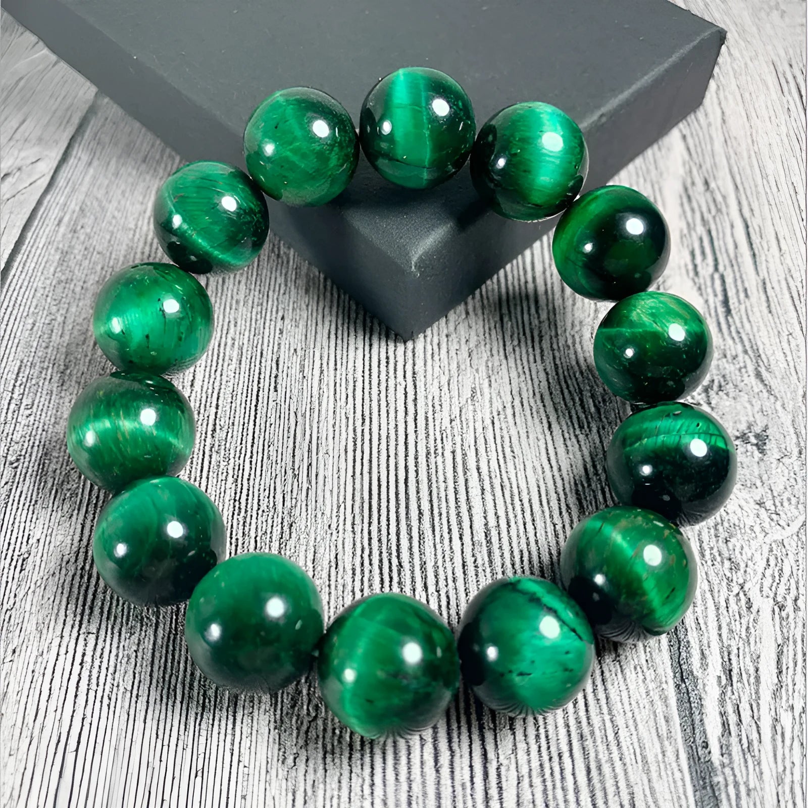 Green Tiger Eye stone bracelet with geometric beads, showing size options.
