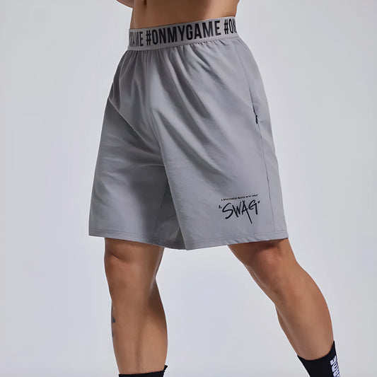 Men's loose grey sports shorts with elastic waistband and letter detail, shown front and back.
