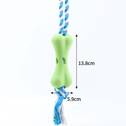Green porous bone dog chew toy with rope knot texture for treat insertion and dental stimulation