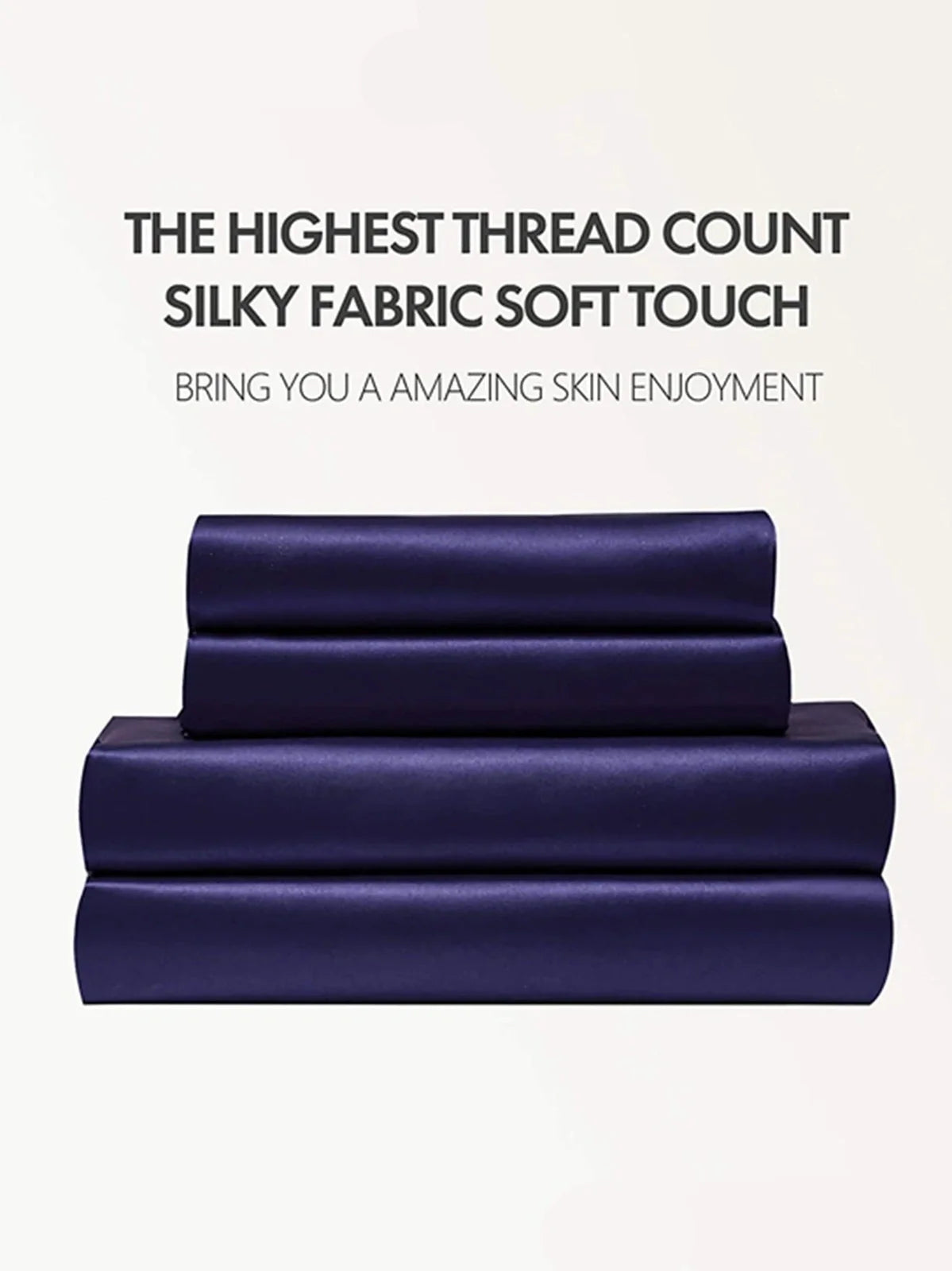 Navy blue floral pattern silk bedding set with quilt cover, fitted sheet, and two pillowcases on bed