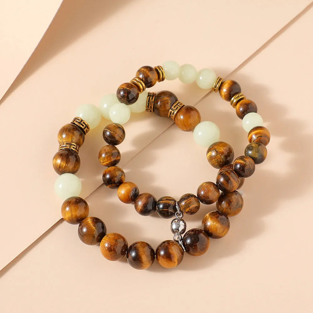 Amber geometric couple bracelets with luminous elements and retro patterning