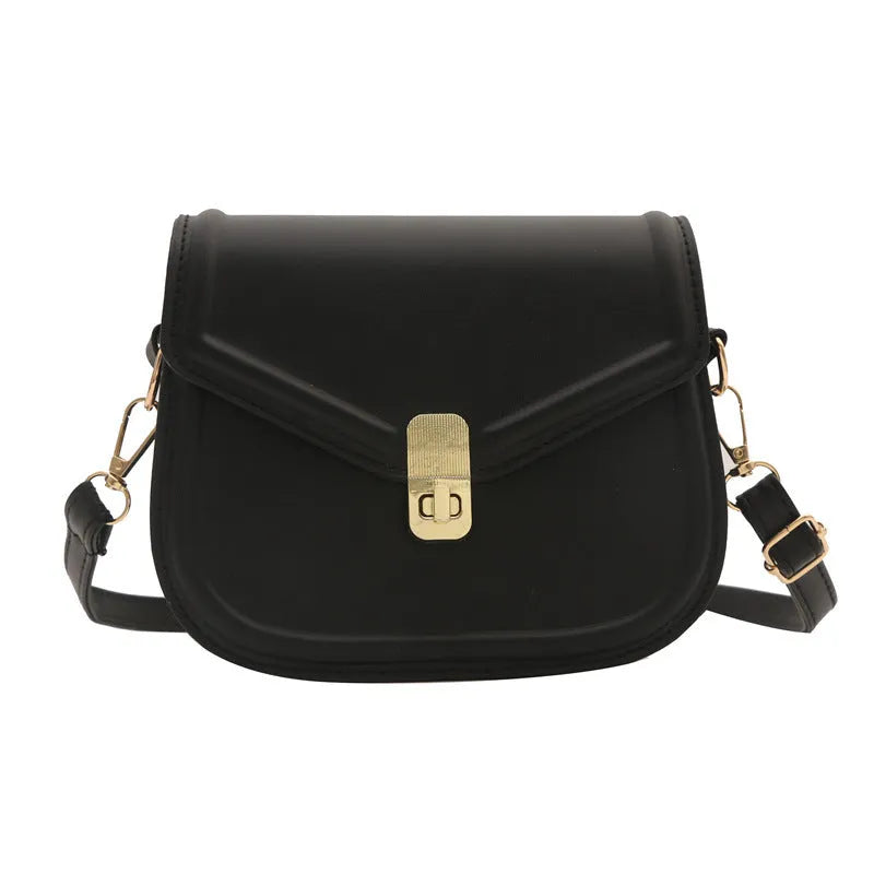 Soft PU leather messenger bag with clamshell opening in black, dark brown, khaki or white.