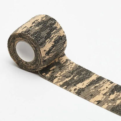 Roll of non-woven elastic camouflage bandage tape in a forest pattern, 4.5 metres long and 5cm wide.