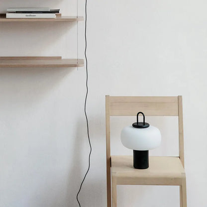 Minimalist Japanese glass bedside table lamp with warm light, 230x330mm dimensions, and UK plug on a children's nightstand.