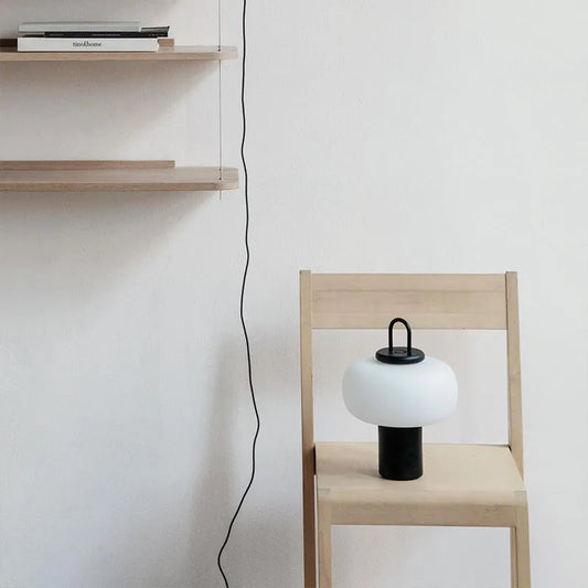 Minimalist Japanese glass bedside table lamp with warm light, 230x330mm dimensions, and UK plug on a children's nightstand.