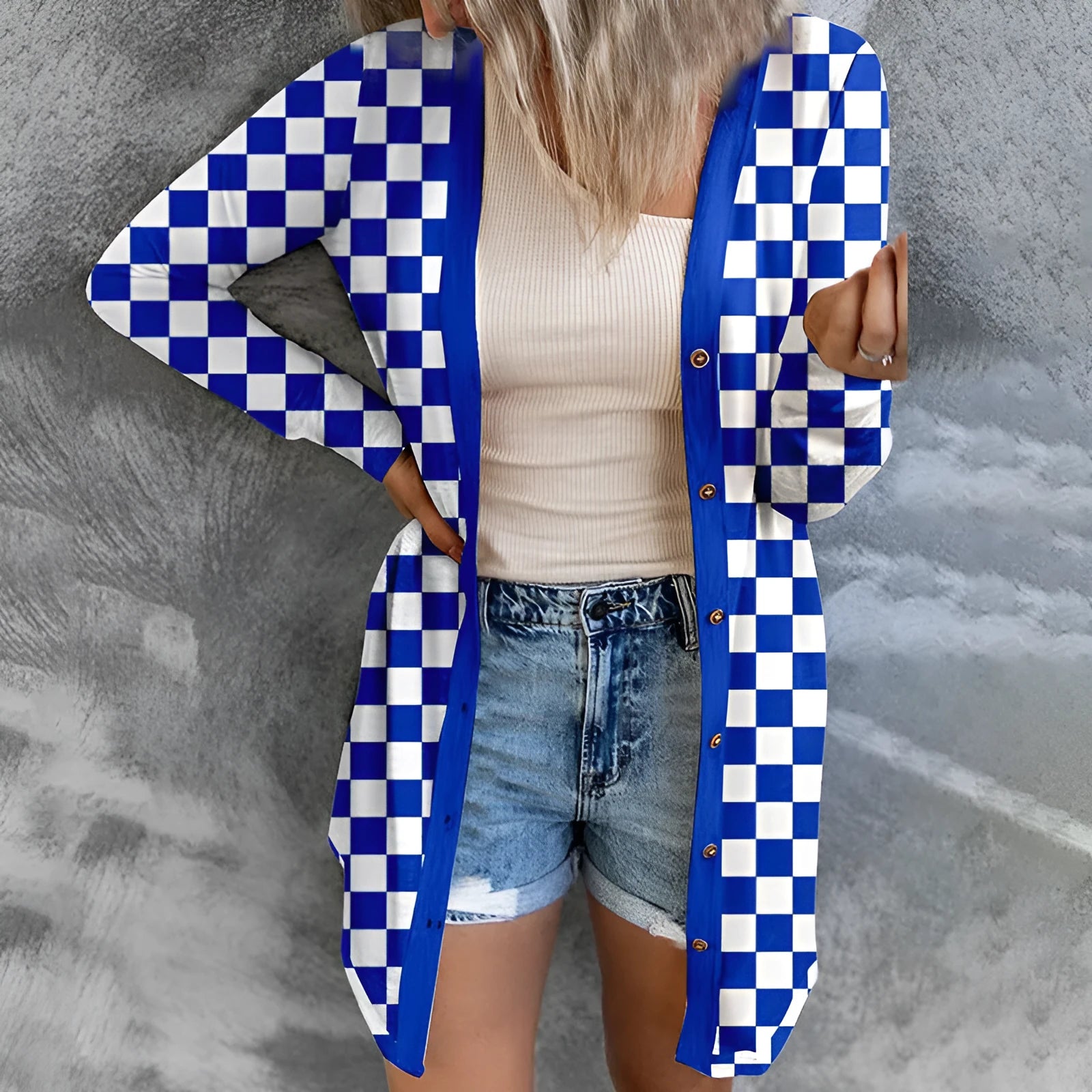 Women's long grey plaid knitted cardigan coat with loose fit and regular sleeves on a hanger