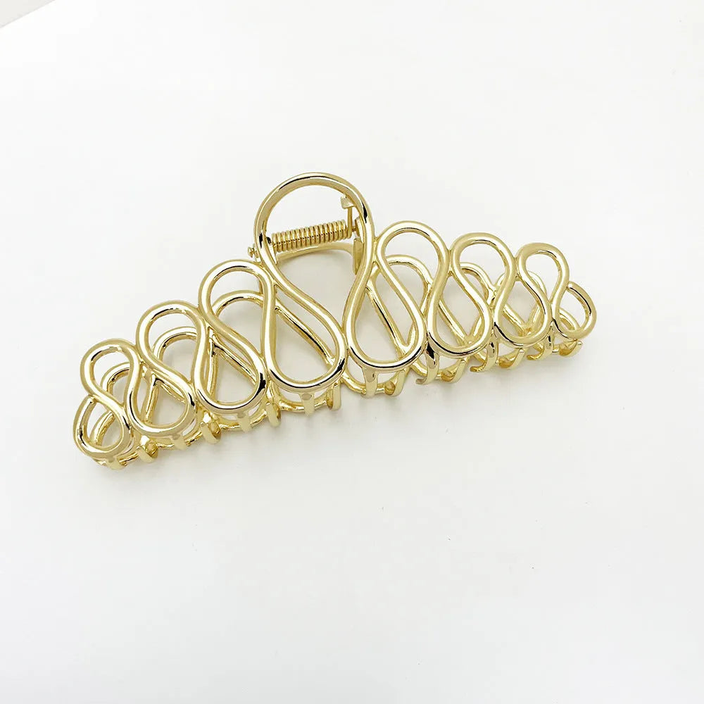 Large gold and silver minimalist hair clip with tassel detail for women's thick hair and updos.