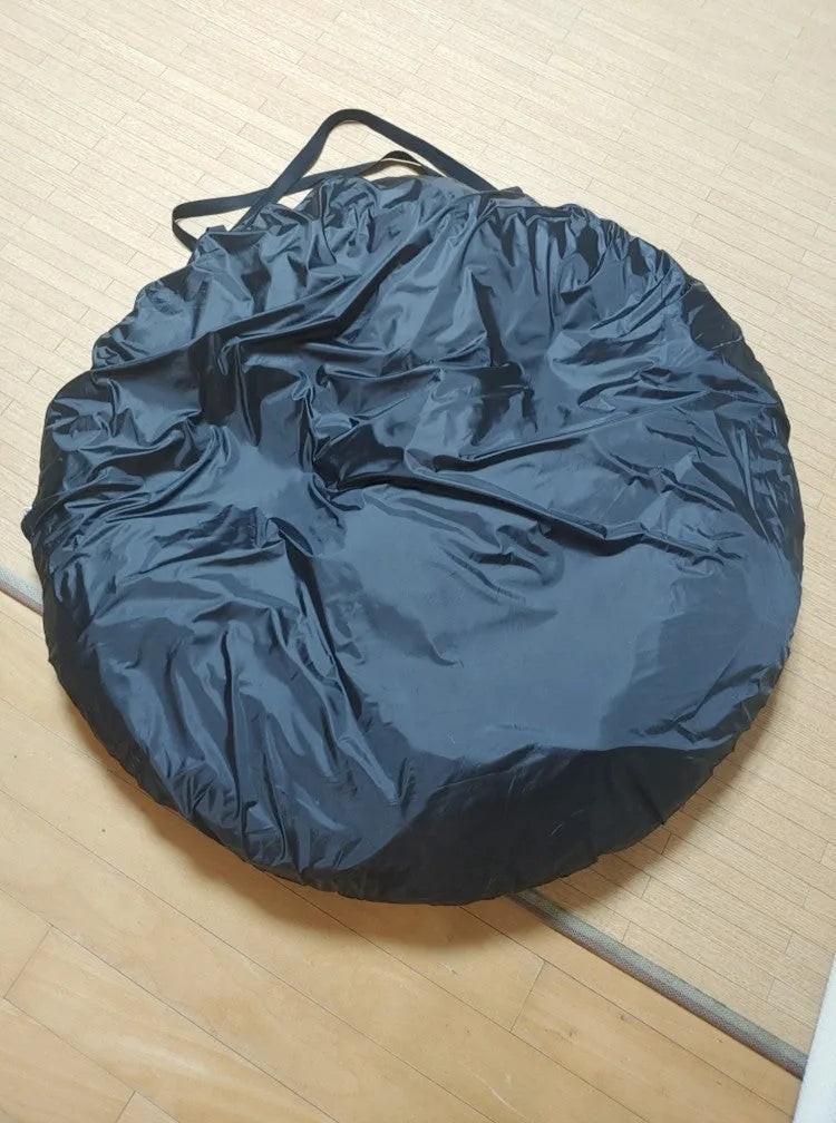 Black pop-up quick-throw car tail tent unfolded to a 200cm cube, set up behind an SUV.