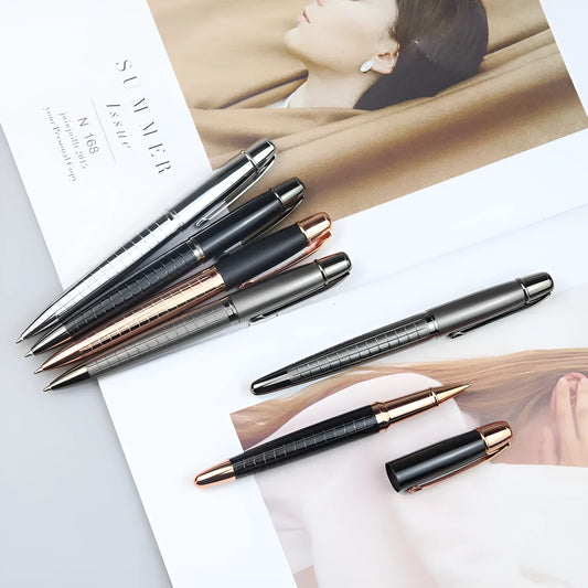 Gun grey metal rollerball pen with a metal barrel on a flat surface.