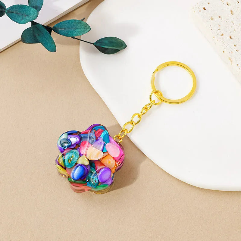 Natural crystal cat's paw keychain pendant showing gemstone options with integrated attachment loop