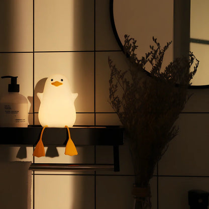 Seagull-shaped silicone night light in blue or yellow measuring 96.5×91×130mm with tap controls