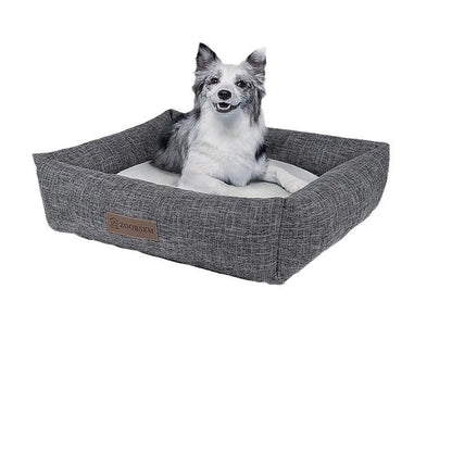 Grey linen fabric square dog bed measuring 60x50cm on a wooden floor