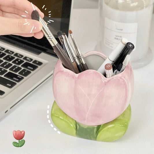 Ceramic floral pen holder showing blue flowers pattern, measuring 11.8cm wide by 10cm high