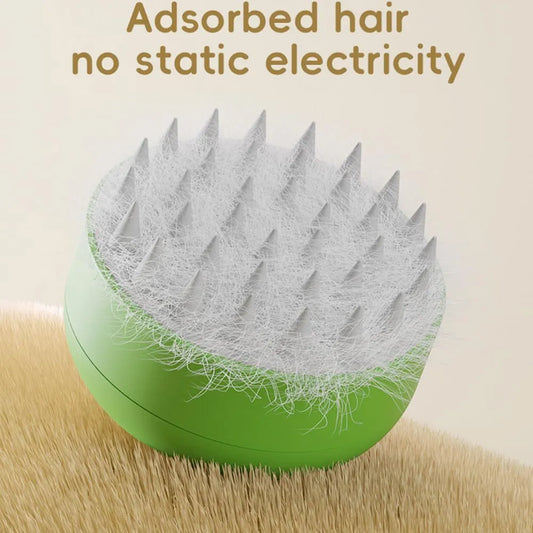 Green and yellow cat steam brush with silicone bristles for grooming pets, measuring 85x85x52mm