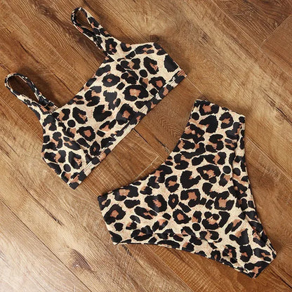Women's leopard print high waist bikini swimsuit set on a mannequin, showing bra and briefs.