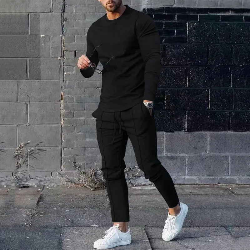 Men's light grey polyester two-piece suit set with long sleeve round neck T-shirt and matching trousers.