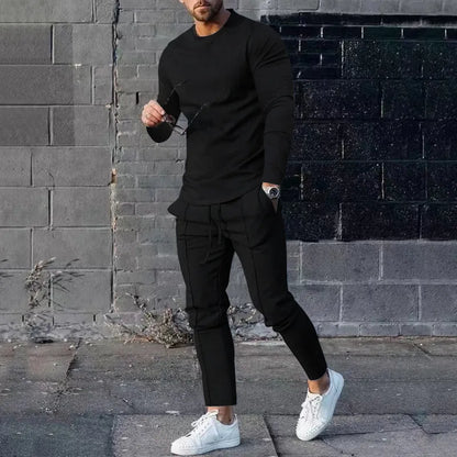 Men's light grey polyester two-piece suit set with long sleeve round neck T-shirt and matching trousers.