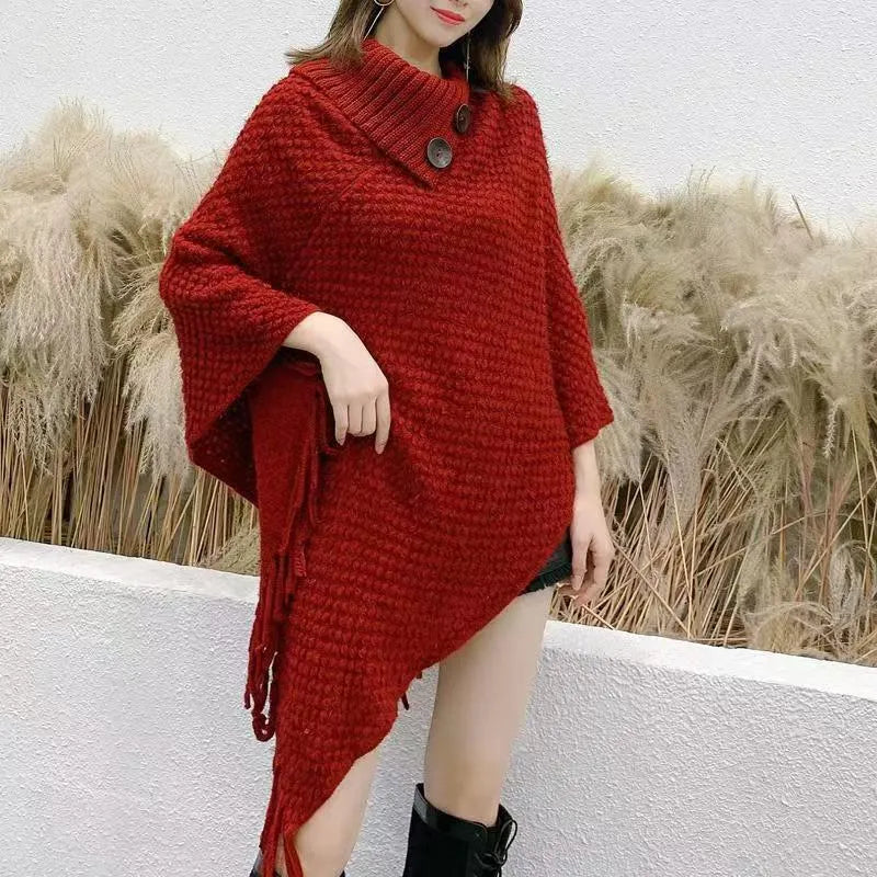 Women's triangle shawl cape in cashmere blend fabric with tassel details, shown draped over shoulders