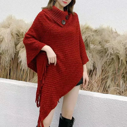 Women's triangle shawl cape in cashmere blend fabric with tassel details, shown draped over shoulders