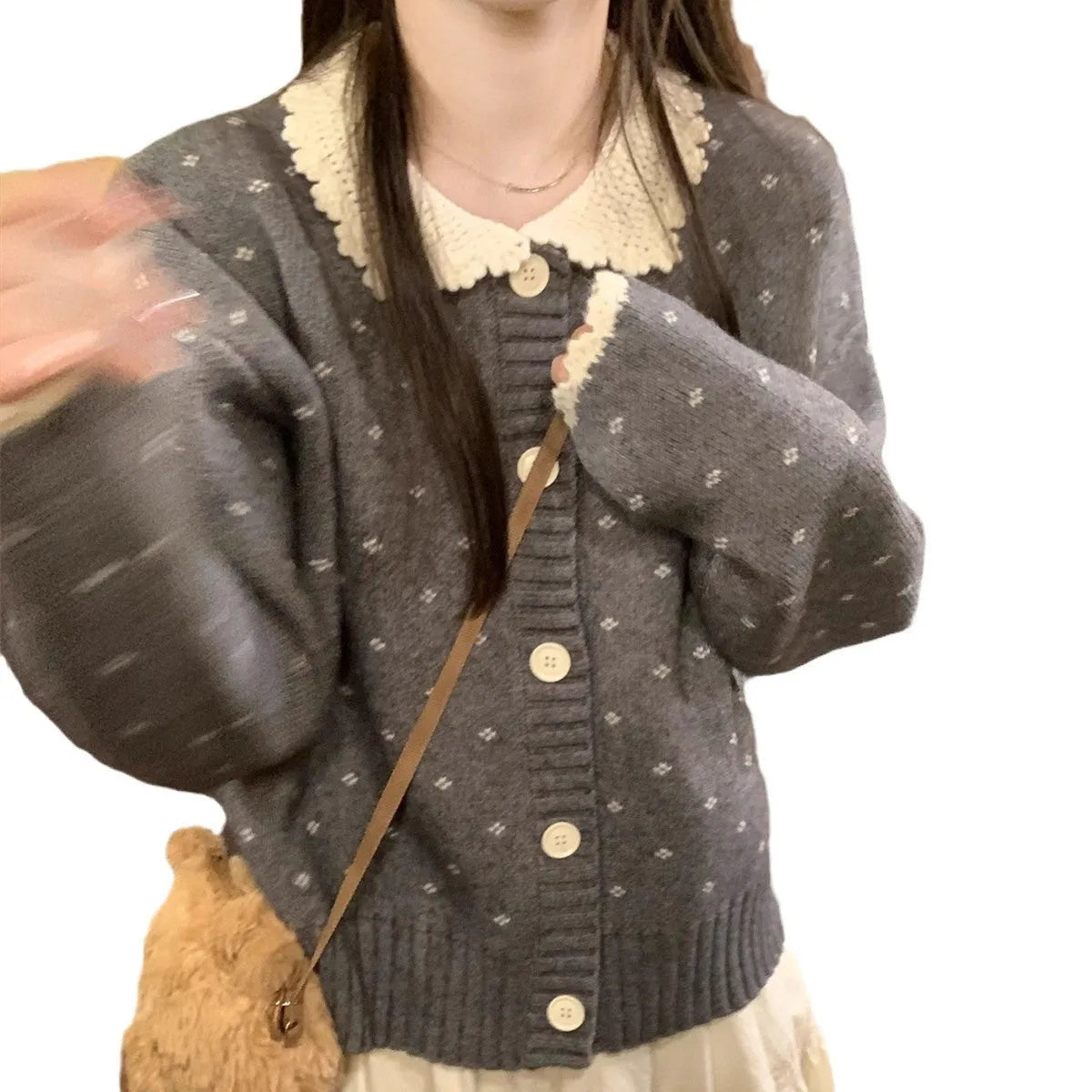 Retro floral patterned cardigan coat with a Peter Pan collar and button front.