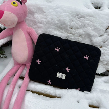 Nylon notebook storage bag with rhombus embroidery and bow, shown in light blue colour.