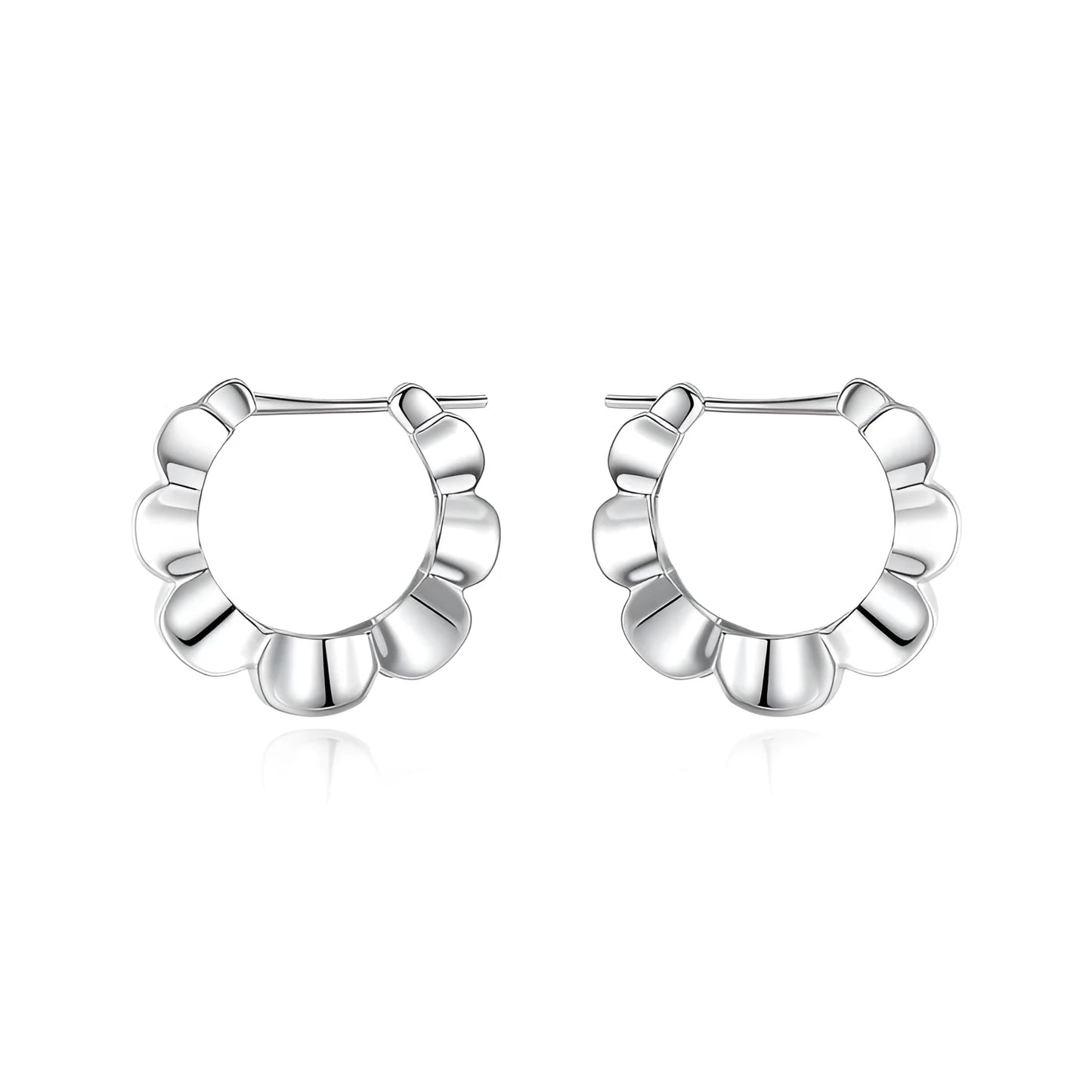 A pair of sterling silver geometric stud earrings with a round centre and butterfly clasp on a grey background.
