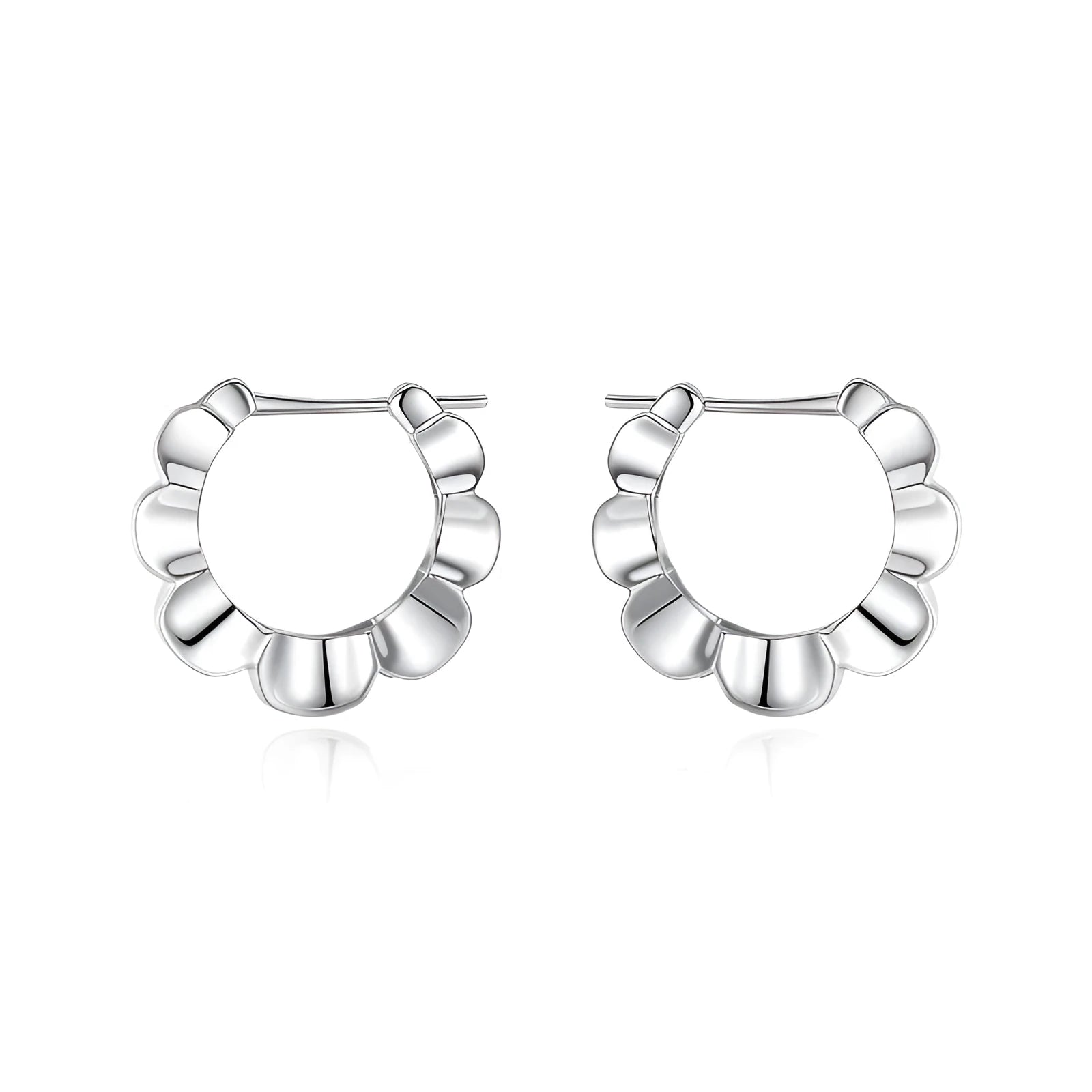 A pair of round, polished sterling silver geometric stud earrings on a plain background.