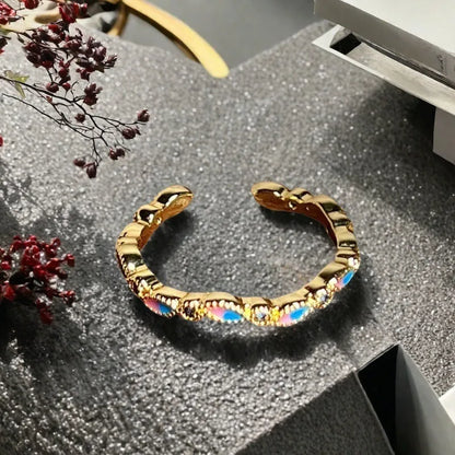 Adjustable copper gourd ring with zircon stones showing flower and bow design elements
