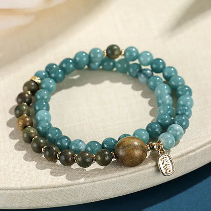 Natural stone blue women's beaded bracelet with geometric shapes and Chinese Fu and Xi characters.