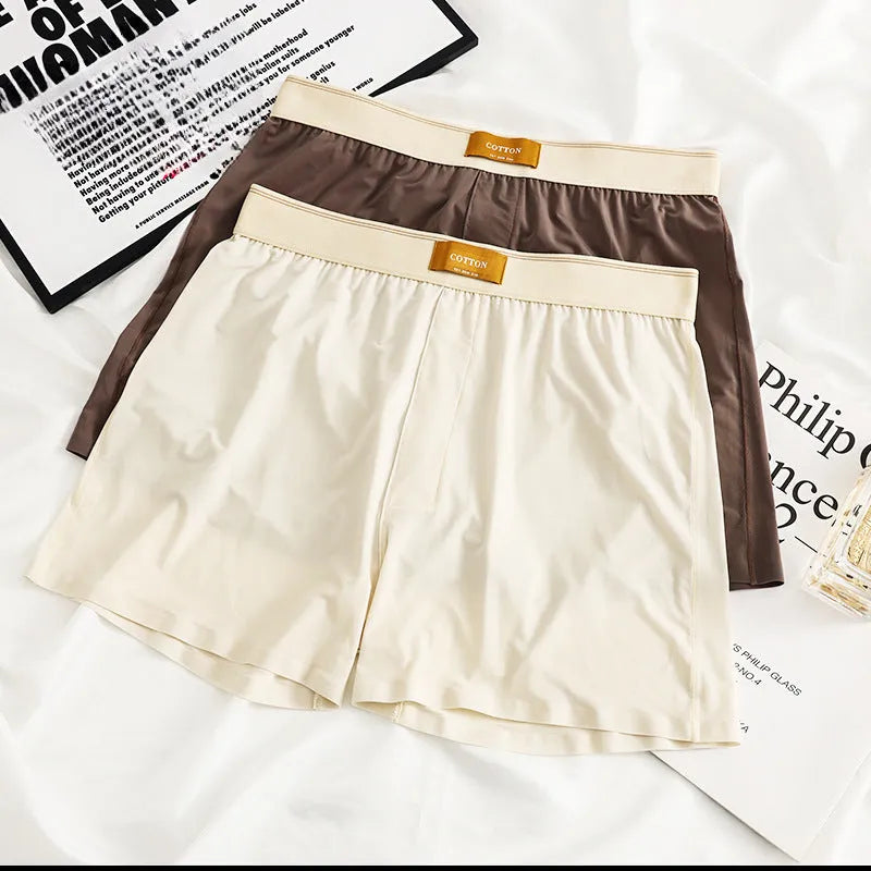 Men's loose-fit Ice Silk nylon underwear in a three-pack, showing colour options like black, green, and grey.
