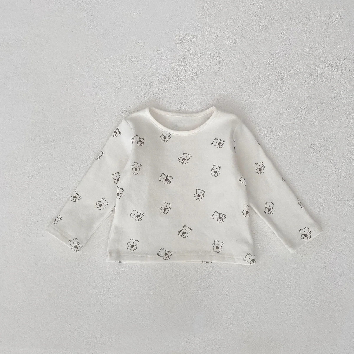 Infant clothing set with suspenders on corduroy trousers and long sleeve top
