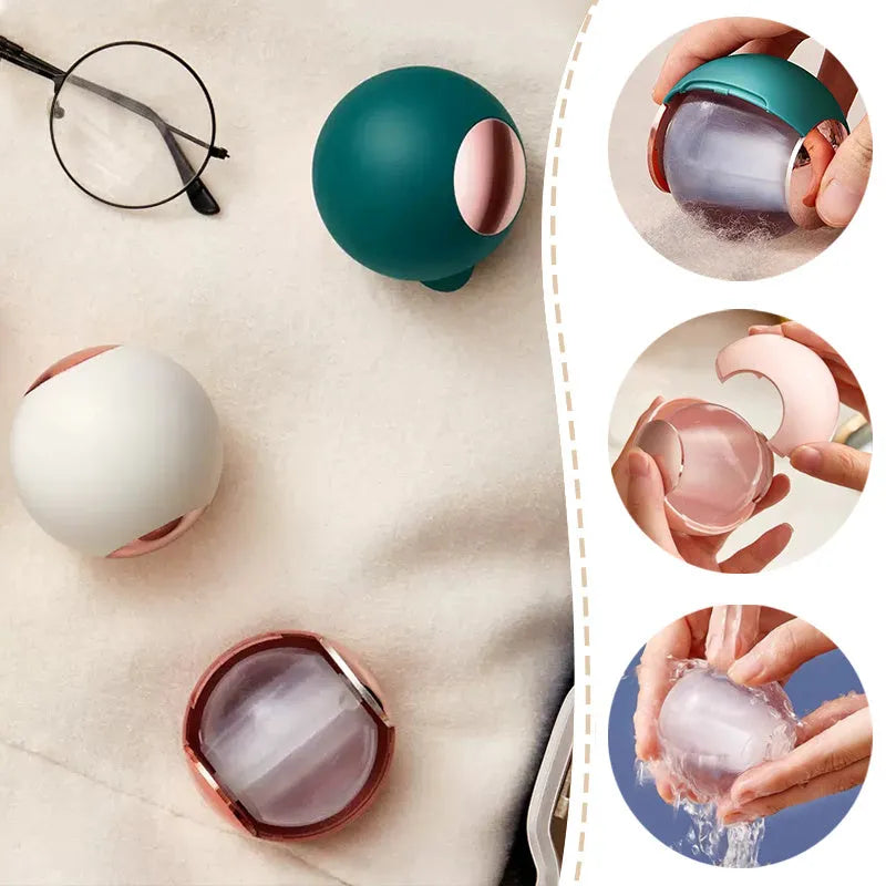 White, pink, green, and deep pink coloured ABS hair removal ball with a handle for pet hair and lint.