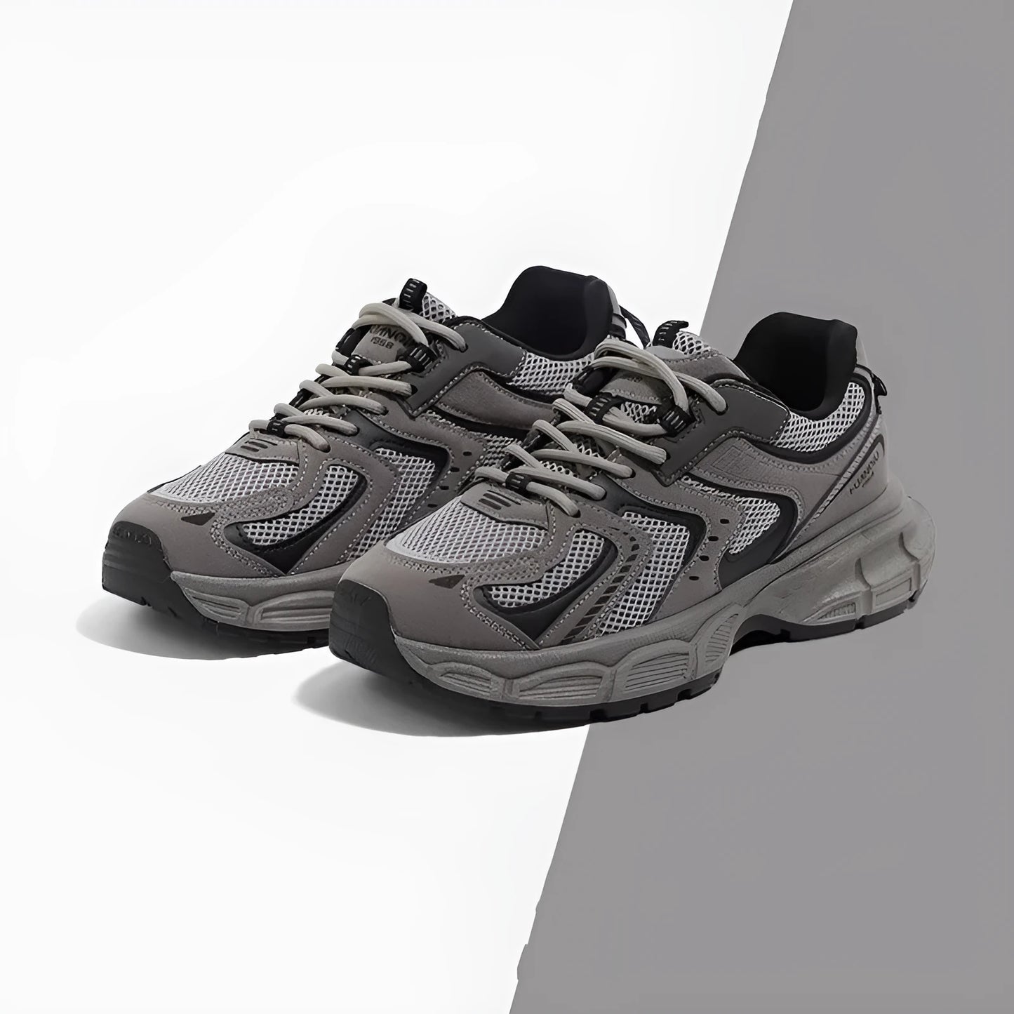 Grey platform casual sneaker with PU mesh upper, leather stitching, and a flat EVA sole.