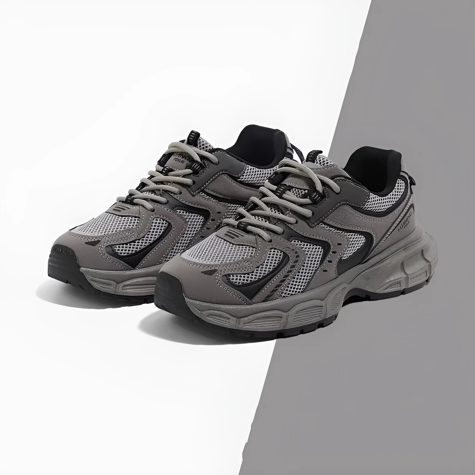 Grey platform casual sneaker with PU mesh upper, leather stitching, and a flat EVA sole.